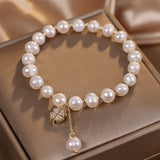 Bracelet en Perle d'Eau Douce avec Pendentif Trèfle à Quatre Feuilles - Biloria