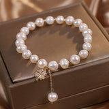 Bracelet en Perle d'Eau Douce avec Pendentif Trèfle à Quatre Feuilles - Biloria
